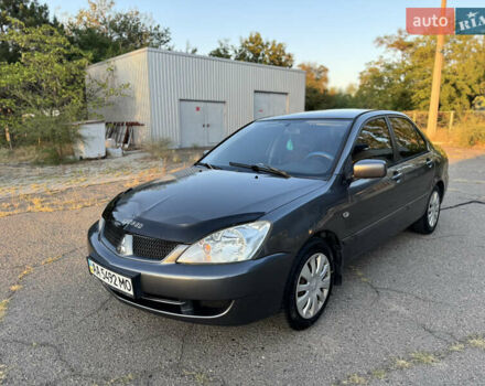 Сірий Міцубісі Lancer, об'ємом двигуна 1.6 л та пробігом 302 тис. км за 3600 $, фото 1 на Automoto.ua