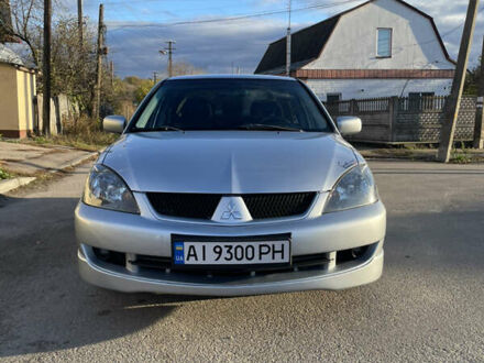Сірий Міцубісі Lancer, об'ємом двигуна 2 л та пробігом 177 тис. км за 5399 $, фото 1 на Automoto.ua