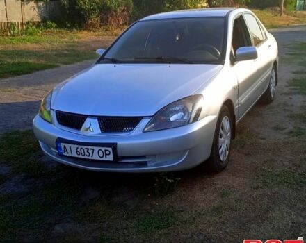 Серый Мицубиси Лансер, объемом двигателя 1.6 л и пробегом 260 тыс. км за 4000 $, фото 1 на Automoto.ua