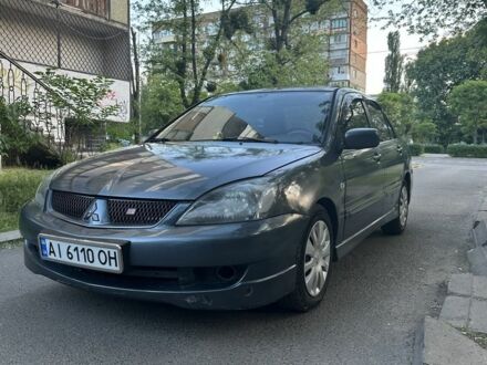 Сірий Міцубісі Lancer, об'ємом двигуна 2 л та пробігом 243 тис. км за 3650 $, фото 1 на Automoto.ua