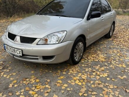 Серый Мицубиси Лансер, объемом двигателя 1.6 л и пробегом 180 тыс. км за 2500 $, фото 1 на Automoto.ua