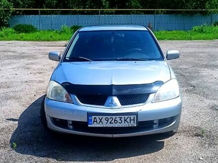 Серый Мицубиси Лансер, объемом двигателя 1.6 л и пробегом 274 тыс. км за 3000 $, фото 1 на Automoto.ua