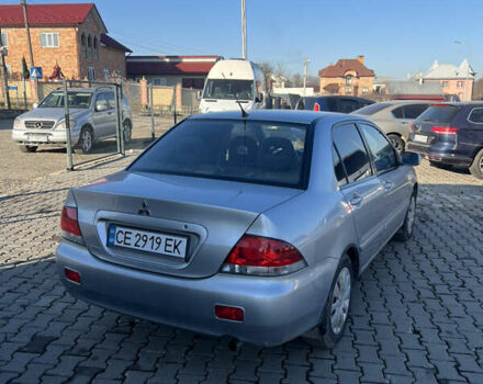 Серый Мицубиси Лансер, объемом двигателя 1.58 л и пробегом 180 тыс. км за 3800 $, фото 1 на Automoto.ua