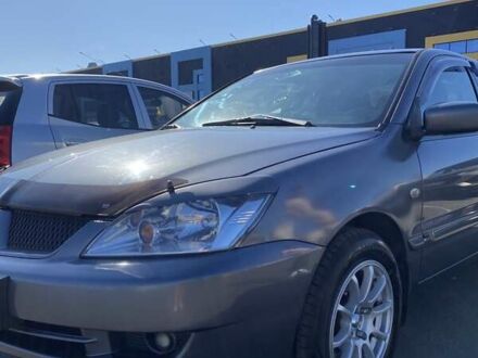 Серый Мицубиси Лансер, объемом двигателя 1.6 л и пробегом 293 тыс. км за 5000 $, фото 1 на Automoto.ua