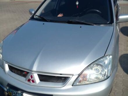 Серый Мицубиси Лансер, объемом двигателя 1.6 л и пробегом 210 тыс. км за 3500 $, фото 1 на Automoto.ua
