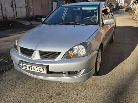 Серый Мицубиси Лансер, объемом двигателя 2 л и пробегом 353 тыс. км за 4800 $, фото 1 на Automoto.ua