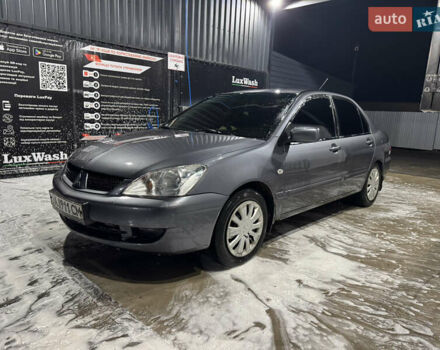 Сірий Міцубісі Lancer, об'ємом двигуна 1.58 л та пробігом 269 тис. км за 3950 $, фото 1 на Automoto.ua