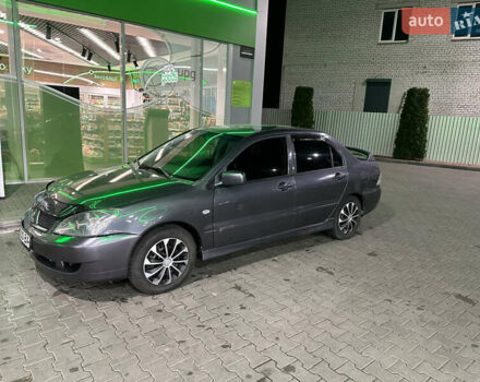 Серый Мицубиси Лансер, объемом двигателя 1.6 л и пробегом 112 тыс. км за 2800 $, фото 1 на Automoto.ua