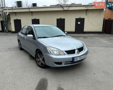 Серый Мицубиси Лансер, объемом двигателя 1.58 л и пробегом 227 тыс. км за 3650 $, фото 1 на Automoto.ua