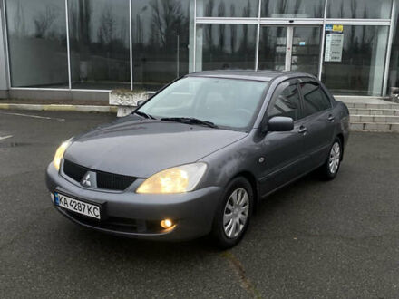 Серый Мицубиси Лансер, объемом двигателя 1.6 л и пробегом 346 тыс. км за 4299 $, фото 1 на Automoto.ua