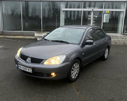 Серый Мицубиси Лансер, объемом двигателя 1.6 л и пробегом 346 тыс. км за 4299 $, фото 1 на Automoto.ua