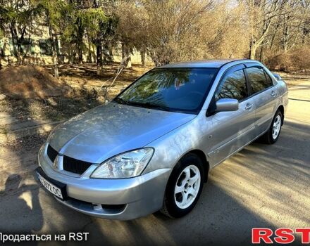 Серый Мицубиси Лансер, объемом двигателя 1.6 л и пробегом 220 тыс. км за 3600 $, фото 1 на Automoto.ua