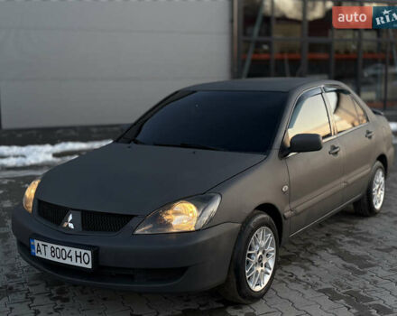 Сірий Міцубісі Lancer, об'ємом двигуна 1.58 л та пробігом 250 тис. км за 3750 $, фото 1 на Automoto.ua
