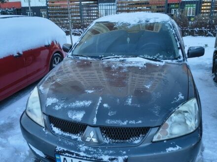 Сірий Міцубісі Lancer, об'ємом двигуна 1.6 л та пробігом 230 тис. км за 3201 $, фото 1 на Automoto.ua