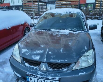 Серый Мицубиси Лансер, объемом двигателя 1.6 л и пробегом 230 тыс. км за 3201 $, фото 1 на Automoto.ua