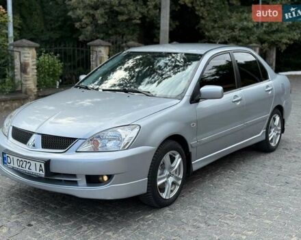 Сірий Міцубісі Lancer, об'ємом двигуна 1.58 л та пробігом 241 тис. км за 3750 $, фото 1 на Automoto.ua