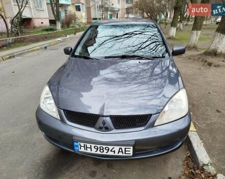 Серый Мицубиси Лансер, объемом двигателя 1.58 л и пробегом 250 тыс. км за 4750 $, фото 1 на Automoto.ua