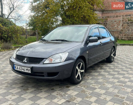 Сірий Міцубісі Lancer, об'ємом двигуна 1.58 л та пробігом 254 тис. км за 3200 $, фото 1 на Automoto.ua