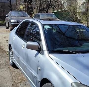 Серый Мицубиси Лансер, объемом двигателя 2 л и пробегом 297 тыс. км за 4600 $, фото 1 на Automoto.ua