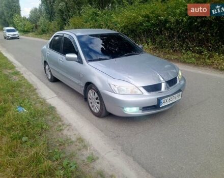 Сірий Міцубісі Lancer, об'ємом двигуна 1.58 л та пробігом 200 тис. км за 2300 $, фото 1 на Automoto.ua