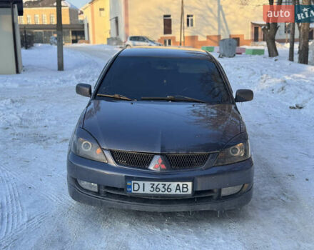 Серый Мицубиси Лансер, объемом двигателя 1.58 л и пробегом 200 тыс. км за 3200 $, фото 1 на Automoto.ua