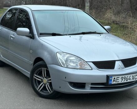 Серый Мицубиси Лансер, объемом двигателя 1.6 л и пробегом 225 тыс. км за 3300 $, фото 1 на Automoto.ua