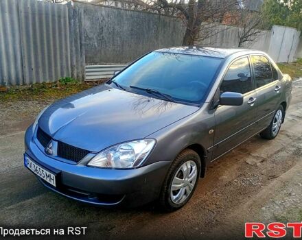 Серый Мицубиси Лансер, объемом двигателя 1.6 л и пробегом 350 тыс. км за 3200 $, фото 1 на Automoto.ua