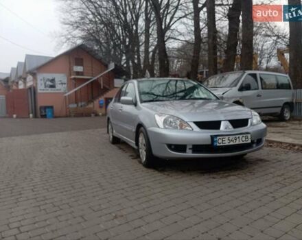 Серый Мицубиси Лансер, объемом двигателя 1.58 л и пробегом 175 тыс. км за 4000 $, фото 1 на Automoto.ua