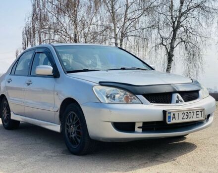 Серый Мицубиси Лансер, объемом двигателя 1.6 л и пробегом 369 тыс. км за 2600 $, фото 1 на Automoto.ua