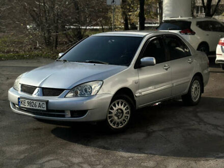 Серый Мицубиси Лансер, объемом двигателя 1.6 л и пробегом 249 тыс. км за 5100 $, фото 1 на Automoto.ua