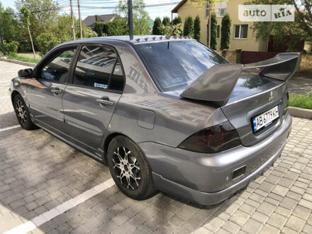 Сірий Міцубісі Lancer, об'ємом двигуна 1.58 л та пробігом 257 тис. км за 4400 $, фото 1 на Automoto.ua