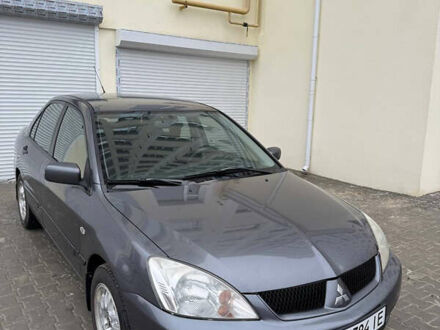 Серый Мицубиси Лансер, объемом двигателя 1.58 л и пробегом 187 тыс. км за 4800 $, фото 1 на Automoto.ua