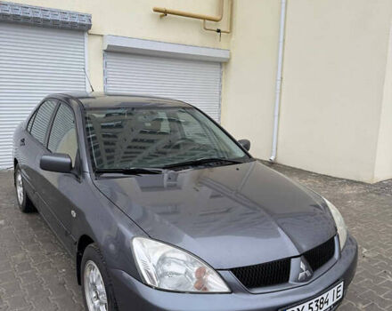 Серый Мицубиси Лансер, объемом двигателя 1.58 л и пробегом 187 тыс. км за 4800 $, фото 1 на Automoto.ua