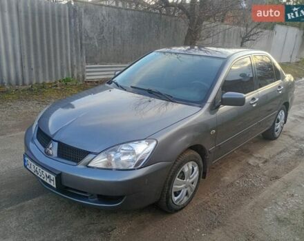 Серый Мицубиси Лансер, объемом двигателя 1.58 л и пробегом 350 тыс. км за 3200 $, фото 1 на Automoto.ua