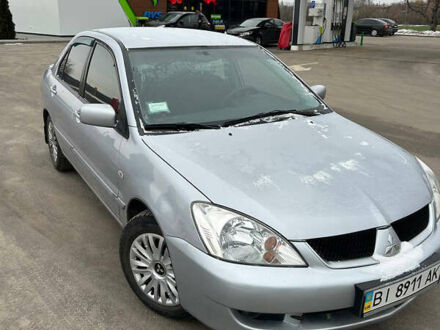 Серый Мицубиси Лансер, объемом двигателя 1.6 л и пробегом 150 тыс. км за 5300 $, фото 1 на Automoto.ua