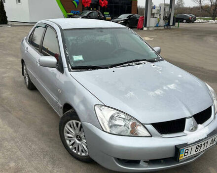 Серый Мицубиси Лансер, объемом двигателя 1.6 л и пробегом 150 тыс. км за 5300 $, фото 1 на Automoto.ua