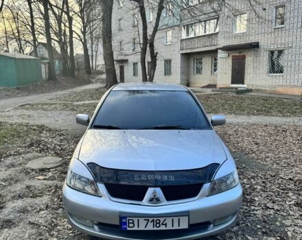 Серый Мицубиси Лансер, объемом двигателя 1.6 л и пробегом 265 тыс. км за 3800 $, фото 1 на Automoto.ua
