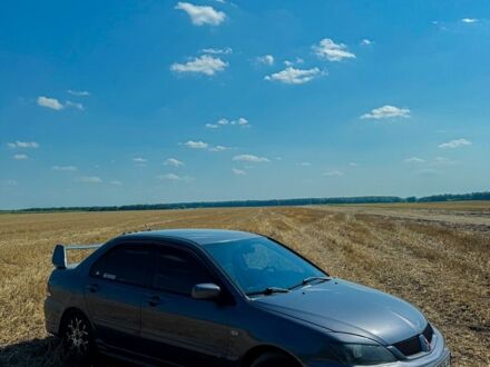 Серый Мицубиси Лансер, объемом двигателя 1.6 л и пробегом 280 тыс. км за 4000 $, фото 1 на Automoto.ua