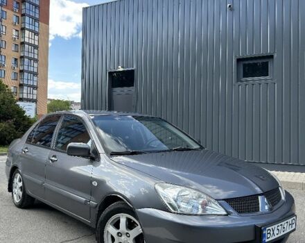 Серый Мицубиси Лансер, объемом двигателя 1 л и пробегом 170 тыс. км за 4600 $, фото 1 на Automoto.ua