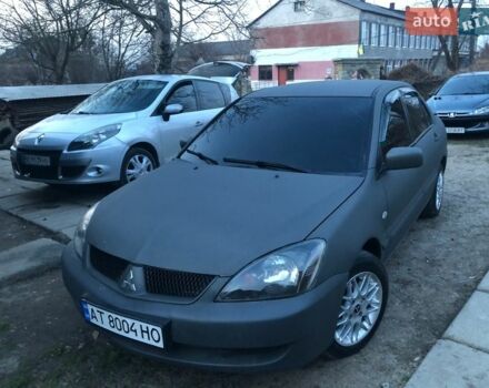 Серый Мицубиси Лансер, объемом двигателя 1.6 л и пробегом 350 тыс. км за 3888 $, фото 1 на Automoto.ua