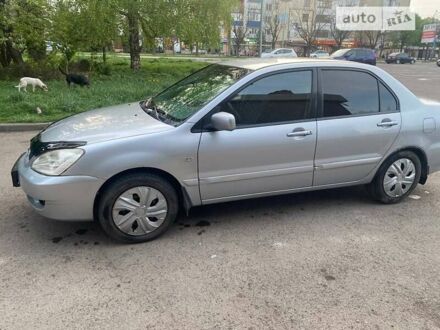 Сірий Міцубісі Lancer, об'ємом двигуна 1.58 л та пробігом 221 тис. км за 3900 $, фото 1 на Automoto.ua