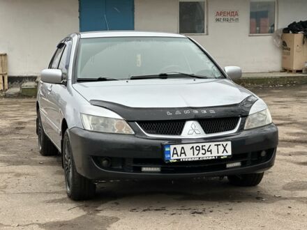Серый Мицубиси Лансер, объемом двигателя 1.6 л и пробегом 298 тыс. км за 3600 $, фото 1 на Automoto.ua