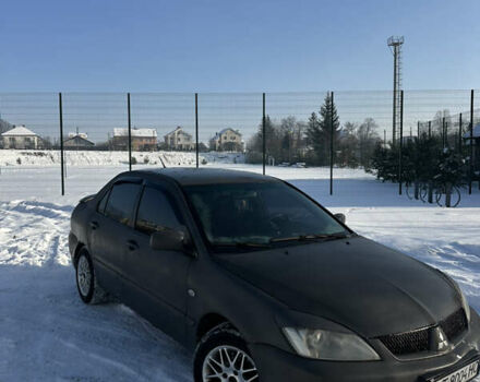 Сірий Міцубісі Lancer, об'ємом двигуна 1.58 л та пробігом 298 тис. км за 2999 $, фото 1 на Automoto.ua