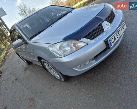 Серый Мицубиси Лансер, объемом двигателя 1.58 л и пробегом 235 тыс. км за 5200 $, фото 1 на Automoto.ua