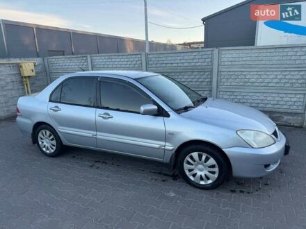 Серый Мицубиси Лансер, объемом двигателя 1.6 л и пробегом 256 тыс. км за 4500 $, фото 1 на Automoto.ua