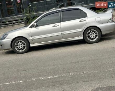 Серый Мицубиси Лансер, объемом двигателя 2 л и пробегом 235 тыс. км за 5100 $, фото 1 на Automoto.ua