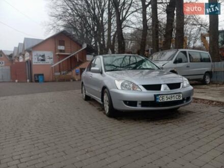 Серый Мицубиси Лансер, объемом двигателя 1.6 л и пробегом 175 тыс. км за 4200 $, фото 1 на Automoto.ua