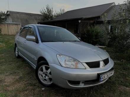 Сірий Міцубісі Lancer, об'ємом двигуна 1.6 л та пробігом 286 тис. км за 3998 $, фото 1 на Automoto.ua