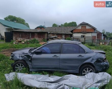 Серый Мицубиси Лансер, объемом двигателя 1.59 л и пробегом 350 тыс. км за 550 $, фото 1 на Automoto.ua