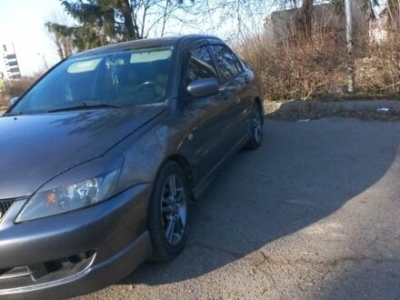 Серый Мицубиси Лансер, объемом двигателя 2 л и пробегом 180 тыс. км за 5000 $, фото 1 на Automoto.ua